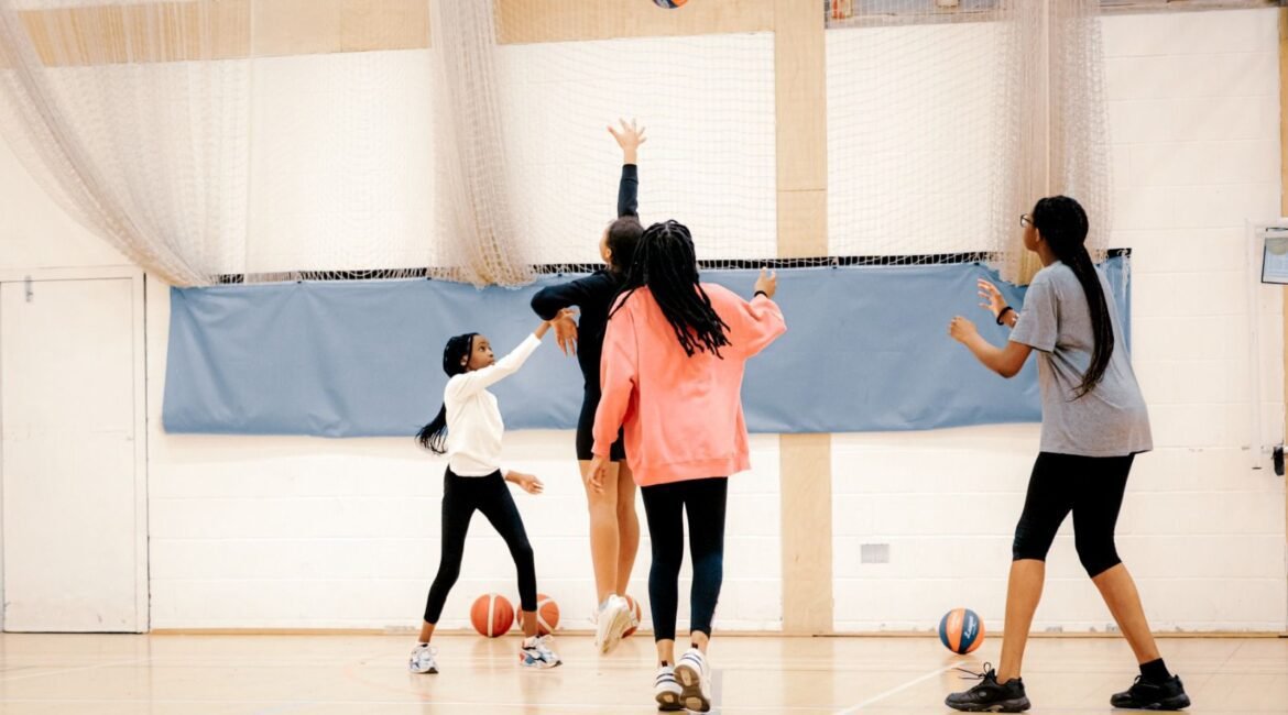 Girls playing a game of basketball